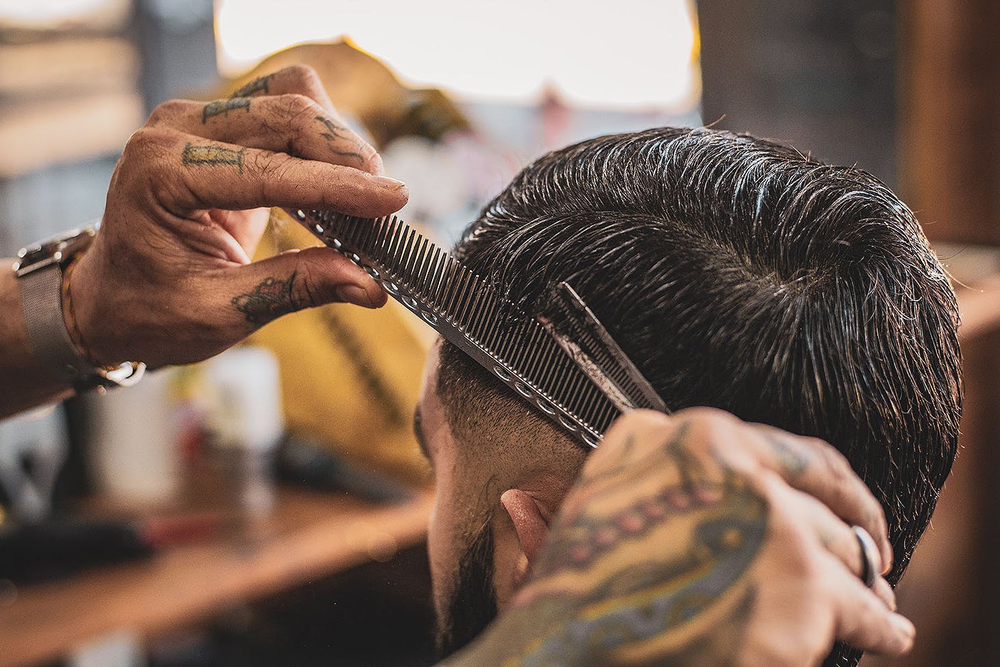 A man gets his hair cut
